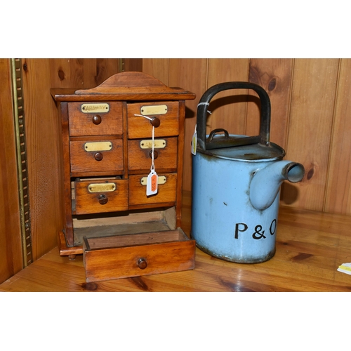 389 - A SMALL SPICE CABINET AND A BLUE ENAMEL HOT WATER POT, comprising a seven drawer spice cabinet, six ... 