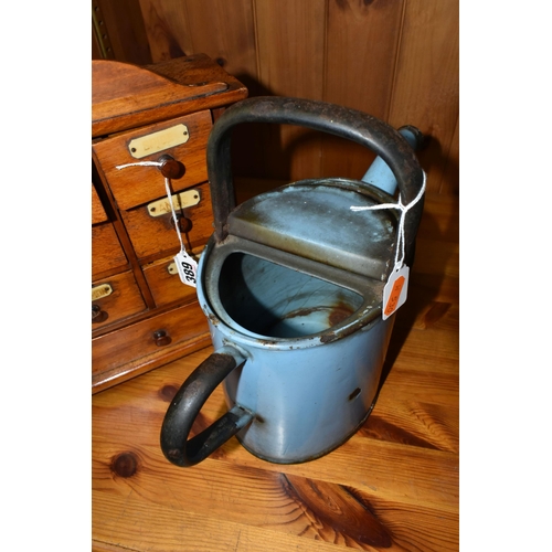 389 - A SMALL SPICE CABINET AND A BLUE ENAMEL HOT WATER POT, comprising a seven drawer spice cabinet, six ... 