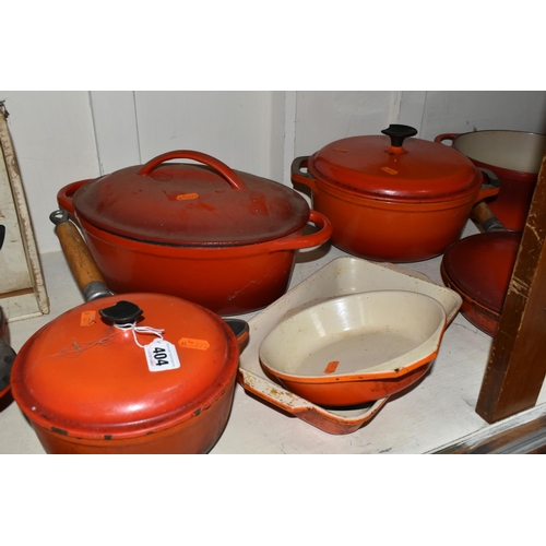 404 - A GROUP OF CAST IRON AND STONEWARE COOKWARE, thirteen pieces to include boxed Le Creuset and other F... 