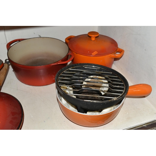 404 - A GROUP OF CAST IRON AND STONEWARE COOKWARE, thirteen pieces to include boxed Le Creuset and other F... 