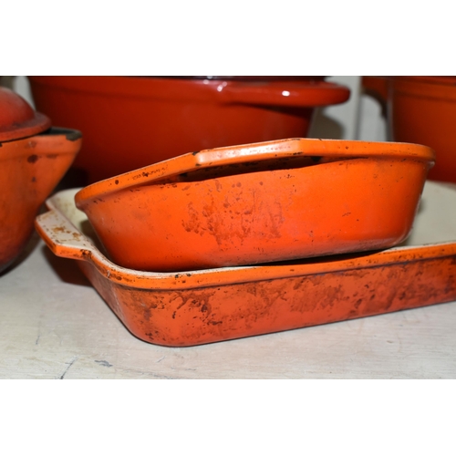 404 - A GROUP OF CAST IRON AND STONEWARE COOKWARE, thirteen pieces to include boxed Le Creuset and other F... 