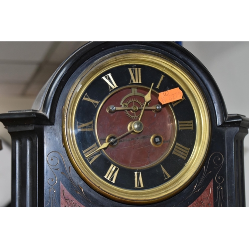 407 - A VICTORIAN FRENCH SLATE MANTEL CLOCK, with red marble inlay, black enamel dial, gilt Roman numerals... 