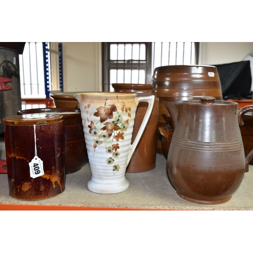 409 - A COLLECTION OF EARTHENWARE SALTGLAZED POTS, comprising a beer keg, two large jars, two twin handled... 