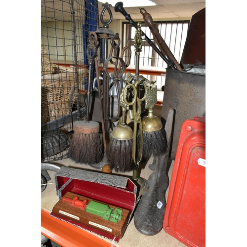 410 - A GROUP OF METALWARE, comprising three fireside companion sets, a metal coal box, a model 300mw turb... 