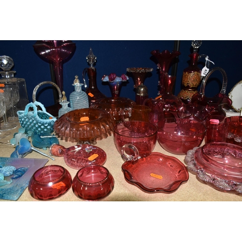 412 - A COLLECTION OF CRANBERRY GLASSWARE, comprising a Bohemian crystal decanter decorated with stylised ... 