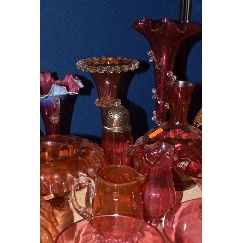 412 - A COLLECTION OF CRANBERRY GLASSWARE, comprising a Bohemian crystal decanter decorated with stylised ... 