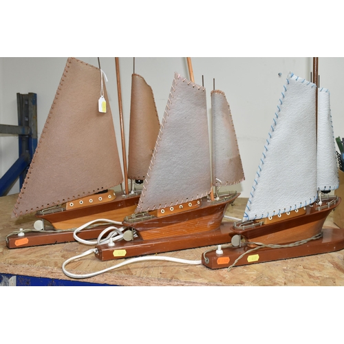 449 - A COLLECTION OF MID-CENTURY WOODEN SAILING BOAT TABLE LAMPS AND ONE BOX OF SPARE PARTS, comprising s... 