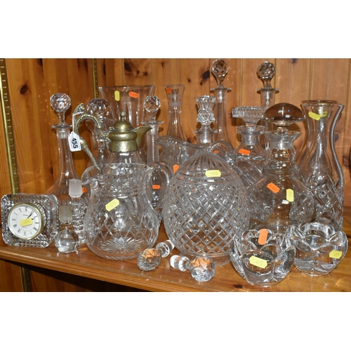 455 - A GROUP OF CUT GLASS, comprising a Victorian cut crystal claret jug with a silverplate lid and handl... 