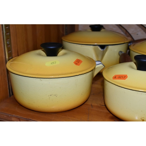 457 - A COLLECTION OF LIDDED LE CREUSET SAUCEPANS IN 'SOLEIL YELLOW', five graduated lidded saucepans, com... 