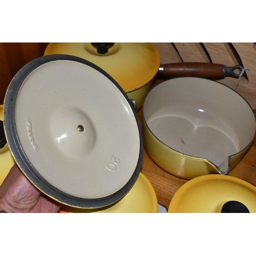 457 - A COLLECTION OF LIDDED LE CREUSET SAUCEPANS IN 'SOLEIL YELLOW', five graduated lidded saucepans, com... 