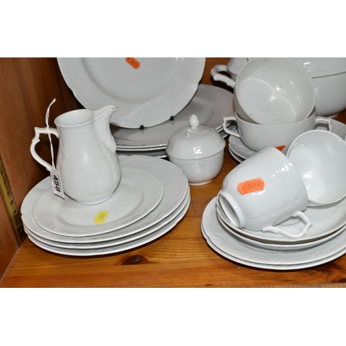 458 - A QUANTITY OF WHITE KAISER 'DUBERRY' DESIGN DINNERWARE, comprising two covered tureens (one has a cr... 