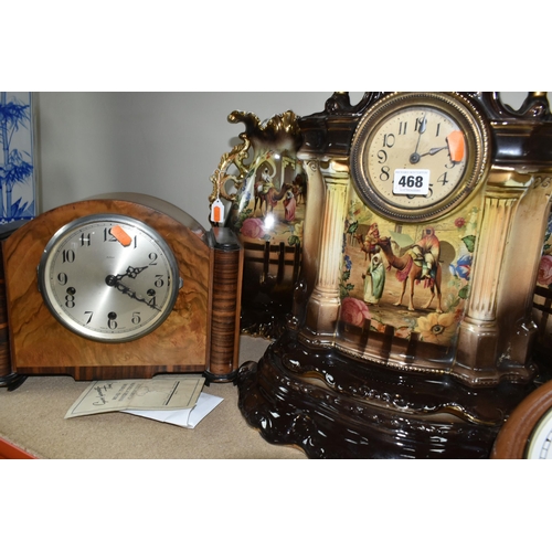 468 - A VICTORIAN PORCELAIN CLOCK GARNITURE, comprising a brown gilt porcelain mantel clock and a brown gi... 