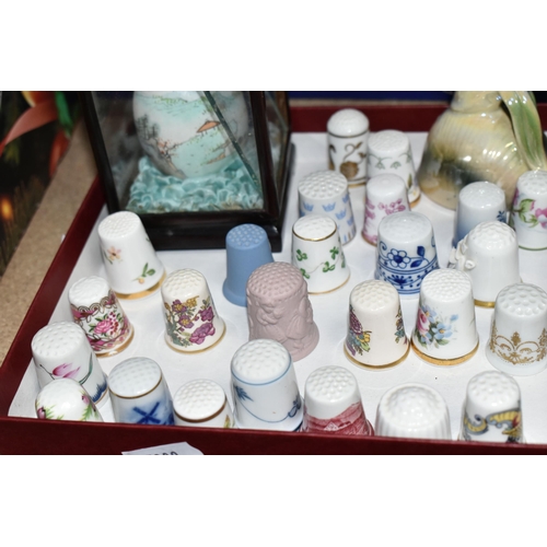 476 - TWO BOXES OF TEAWARE AND GLASSWARE, to include a small thimble collection, a Wedgwood glass 1977 Sil... 