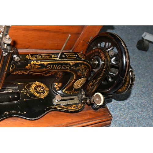 508 - A VICTORIAN SINGER HAND CRANK SEWING MACHINE, possibly an 1884 year model 12k, there are two rows of... 