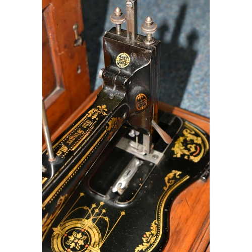 508 - A VICTORIAN SINGER HAND CRANK SEWING MACHINE, possibly an 1884 year model 12k, there are two rows of... 