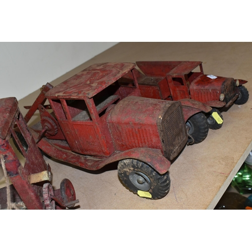 509 - TWO TRI-ANG PLAYWORN RED TRUCKS WITH HARD RUBBER TYRES, A SIMILAR RED PAINTED CRANE, A CHILD'S VULCA... 