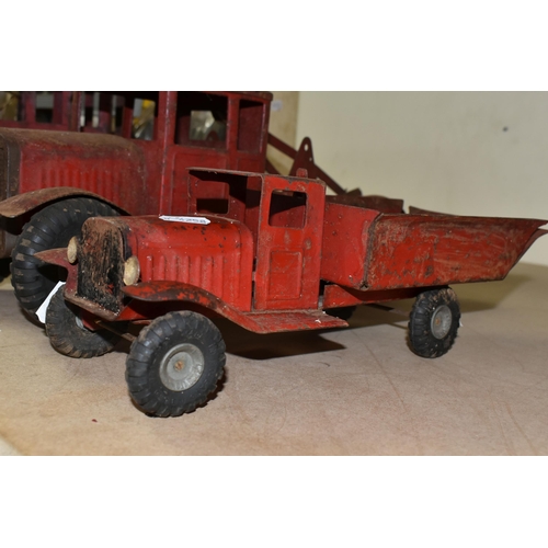 509 - TWO TRI-ANG PLAYWORN RED TRUCKS WITH HARD RUBBER TYRES, A SIMILAR RED PAINTED CRANE, A CHILD'S VULCA... 