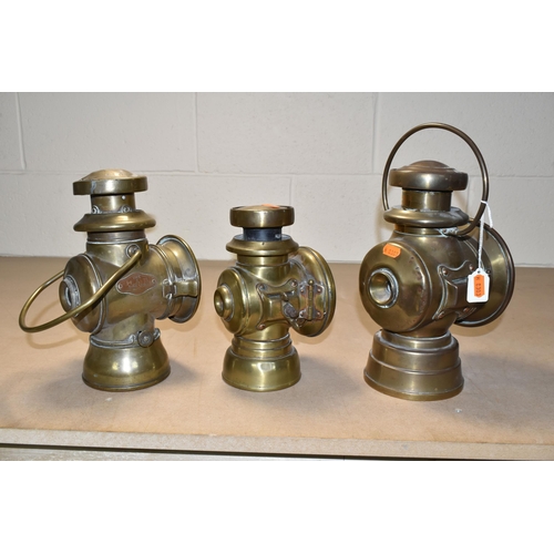 513 - THREE VINTAGE BRASS CAR LAMPS, comprising 'The H & B SIDE LAMP NO 1008', cracked glass to the front,... 