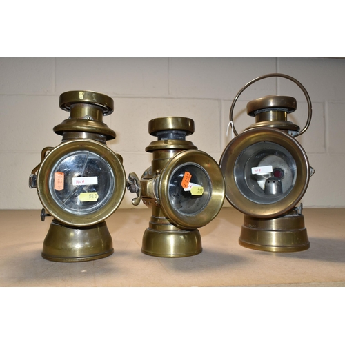 513 - THREE VINTAGE BRASS CAR LAMPS, comprising 'The H & B SIDE LAMP NO 1008', cracked glass to the front,... 