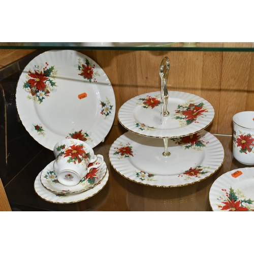 537 - A GROUP OF ROYAL ALBERT TEAWARE, comprising 'poinsettia' pattern two tier cake stand, dinner plate, ... 