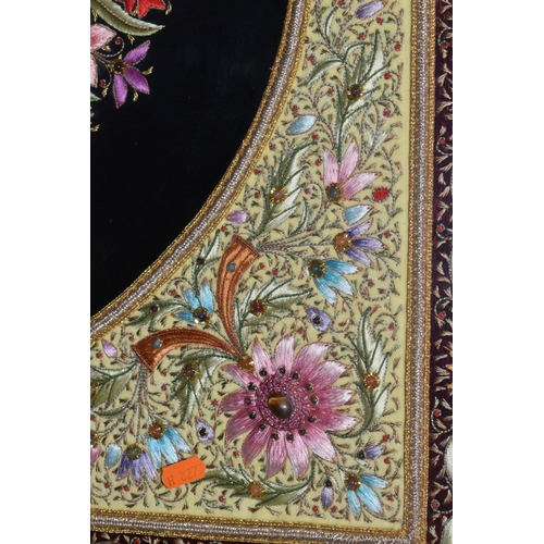 543 - A 20TH CENTURY RAISED NEEDLEWORK PICTURE, depicting still life flower scene to the centre panel bord... 