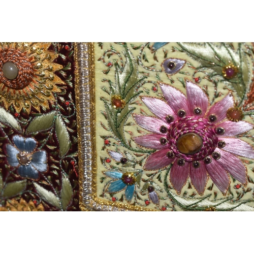 543 - A 20TH CENTURY RAISED NEEDLEWORK PICTURE, depicting still life flower scene to the centre panel bord... 