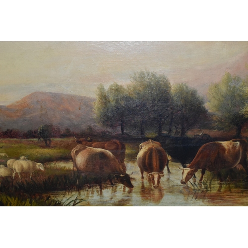 548 - A LATE VICTORIAN PICTURESQUE LANDSCAPE, depicting cattle drinking from a river, no visible signature... 