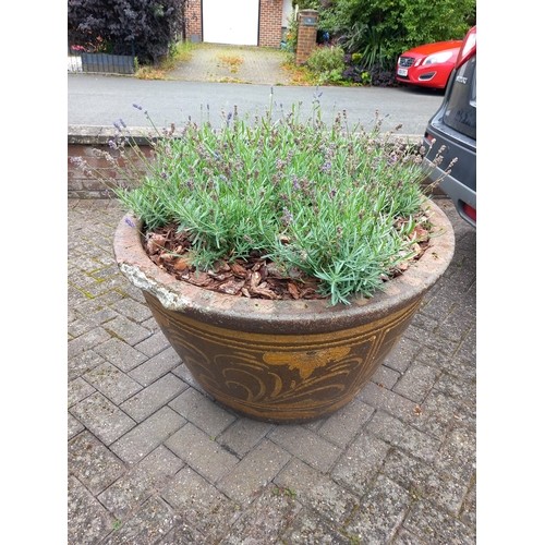 1018 - A LARGE COMPOSITE OVAL TAPERED PLANTER, thats decorated with an oriental pattern, width 118cm x dept... 