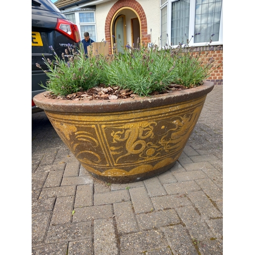 1018 - A LARGE COMPOSITE OVAL TAPERED PLANTER, thats decorated with an oriental pattern, width 118cm x dept... 