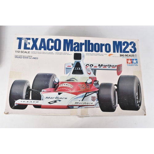 FOUR BOXED UNBUILT TAMIYA MODEL RACECARS, to include a