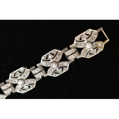 33 - AN ART DECO STYLE DIAMOND BRACELET, nine white metal panels, each set with a single bezel set round ... 