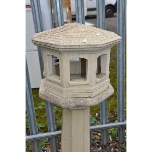 1003 - A COMPOSITE STONE OCTAGONAL BIRD BATH, on a tapered support and base, height 40cm x height 124cm (co... 