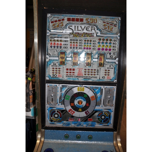 1052 - AN ACE COIN EQUIPMENT VINTAGE SLOT MACHINE with 'Silver Machine' graphics and mechanism, width 53cm ... 