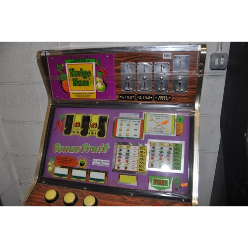 1065 - A VINTAGE BELL FRUITS SLOT MACHINE with 'Bonus Fruits' graphics and mechanism, height 144cm (unteste... 