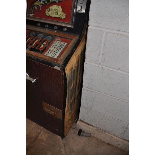 1070 - A VINTAGE 'LEEDS' SLOT MACHINE with 'Penny Duel' graphics, width 67cm x height 140cm (untested and m... 