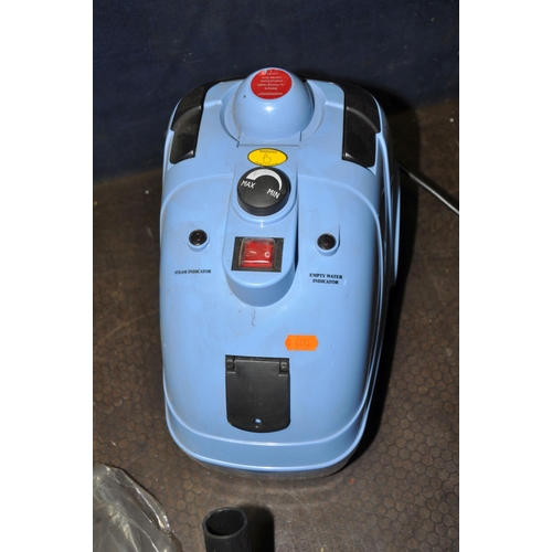 1093 - AN UNBRANDED STEAM CLEANER, with accessories (condition report: turned on but untested)