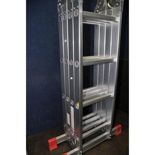 1102 - AN ALUMINIUM FOLDING PLATFORM LADDER, with a packet of sealed treadle plates, height collapsed 122cm