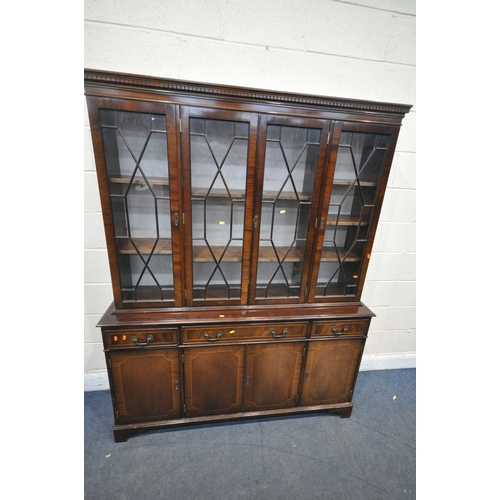 1204 - A MAHOGANY TWIN PEDESTAL DINING TABLE, with a single additional leaf, extended length 210cm x closed... 