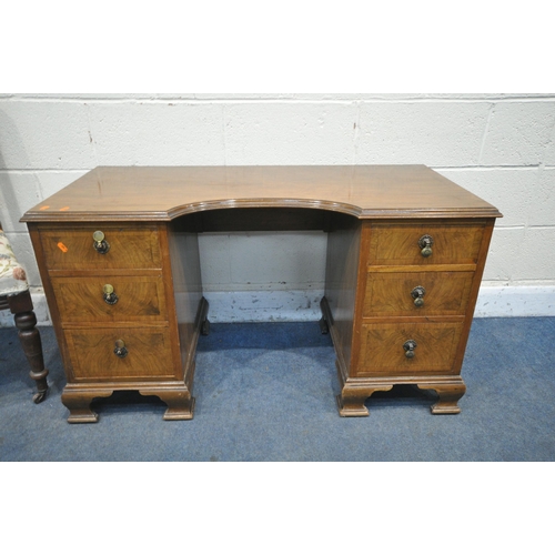 1211 - A WALNUT KNEE HOLE DESK, with six drawers, on bracket feet, width 114cm x depth 53cm x height 65cm, ... 