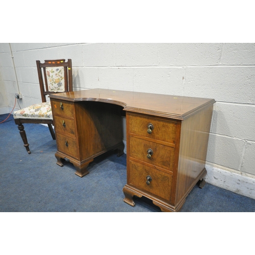 1211 - A WALNUT KNEE HOLE DESK, with six drawers, on bracket feet, width 114cm x depth 53cm x height 65cm, ... 