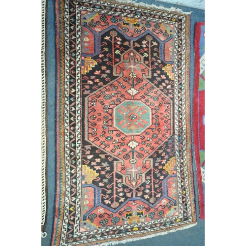 1231 - TWO WOOL PERSIAN RUGS, both of similar patterns, largest rug measurements, 155cm x 97cm, along with ... 