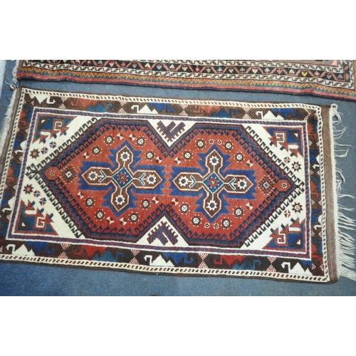 1231 - TWO WOOL PERSIAN RUGS, both of similar patterns, largest rug measurements, 155cm x 97cm, along with ... 