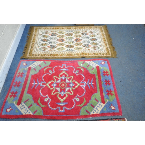 1231 - TWO WOOL PERSIAN RUGS, both of similar patterns, largest rug measurements, 155cm x 97cm, along with ... 