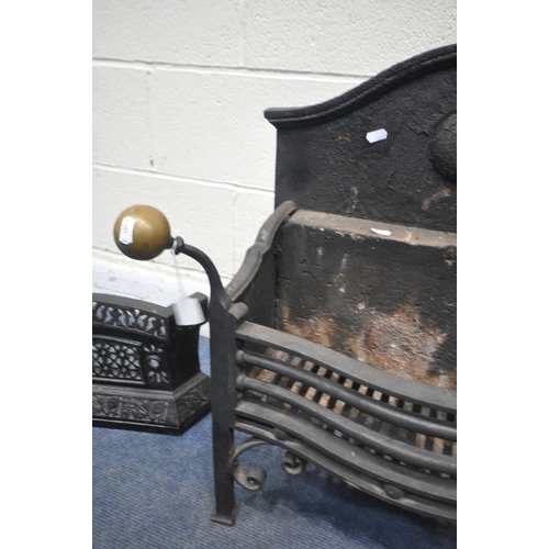 1242 - A CAST IRON FIRE GRATE, with brass finials, width 62cm x depth 34cm x height 67cm, along with a cast... 