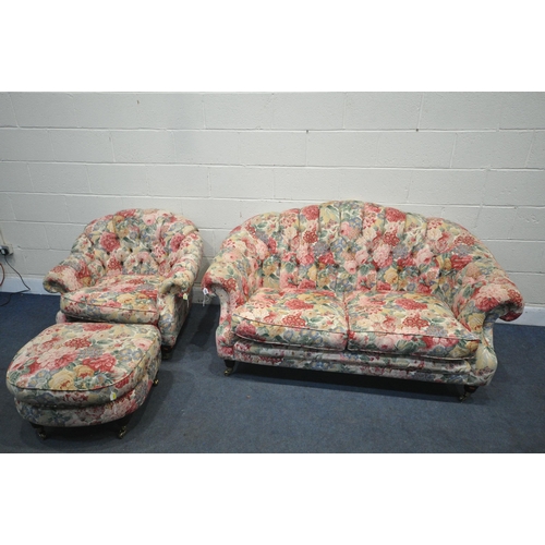 1297 - A FOLORAL UPHOLSTERED THREE PIECE BUTTON BACK SUITE, comprising a two seater sofa, length 164cm x de... 