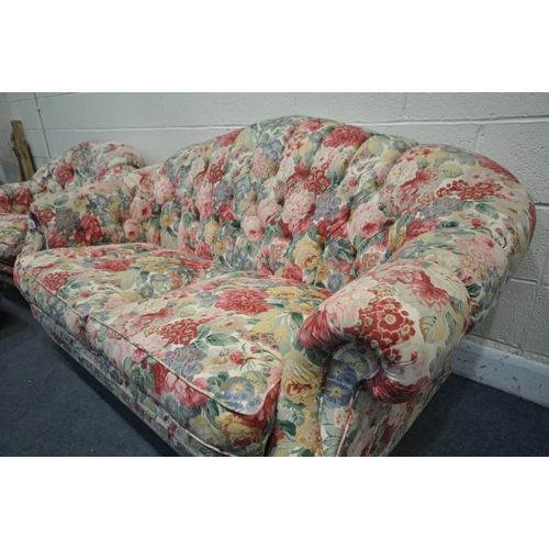 1297 - A FOLORAL UPHOLSTERED THREE PIECE BUTTON BACK SUITE, comprising a two seater sofa, length 164cm x de... 