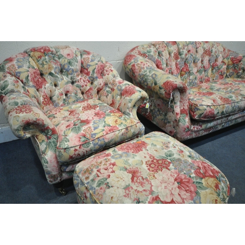 1297 - A FOLORAL UPHOLSTERED THREE PIECE BUTTON BACK SUITE, comprising a two seater sofa, length 164cm x de... 