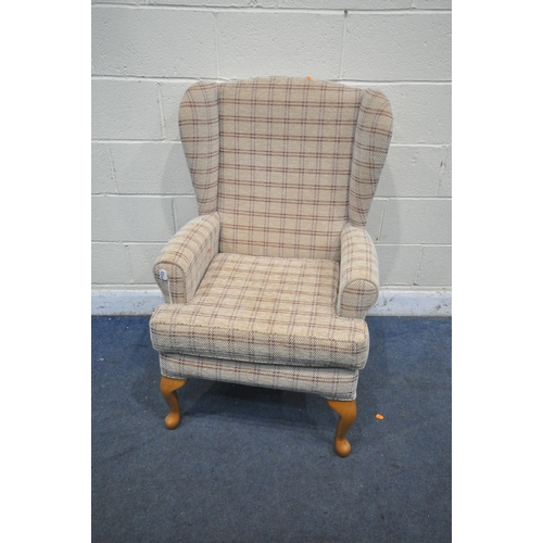 A HSL BEIGE UPHOLSTERED WING BACK ARMCHAIR on front cabriole legs