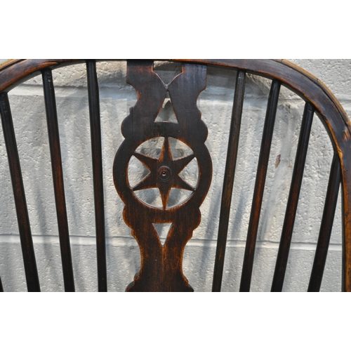 1328 - A 19TH CENTURY ELM WINDSOR CARVER CHAIR, with a spindle back and central star design (condition repo... 