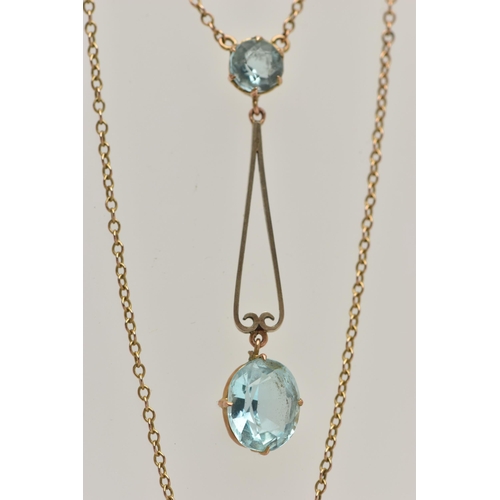 14 - AN EARLY 20TH CENTURY YELLOW METAL PENDANT NECKLACE, the drop pendant set with a pale blue oval cut ... 